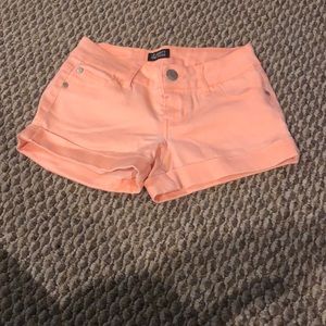 orange-pink jean shorts